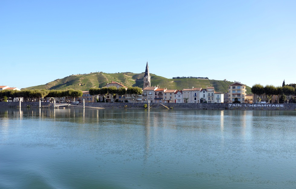 A view from the Rhone river looking up towards Tain l'Hermitage and Hermitage hill