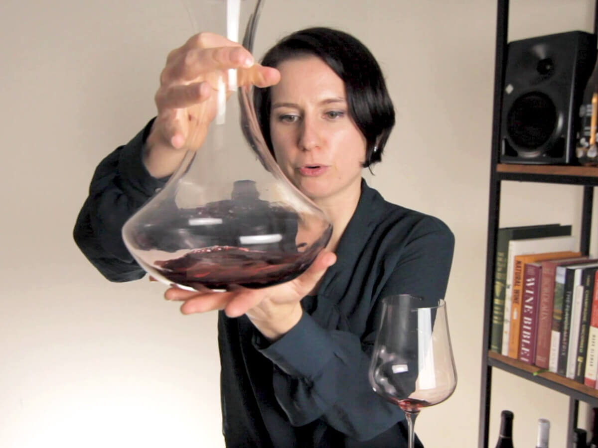 Madeline using a decanter on a bottle of Cabernet Sauvignon red wine