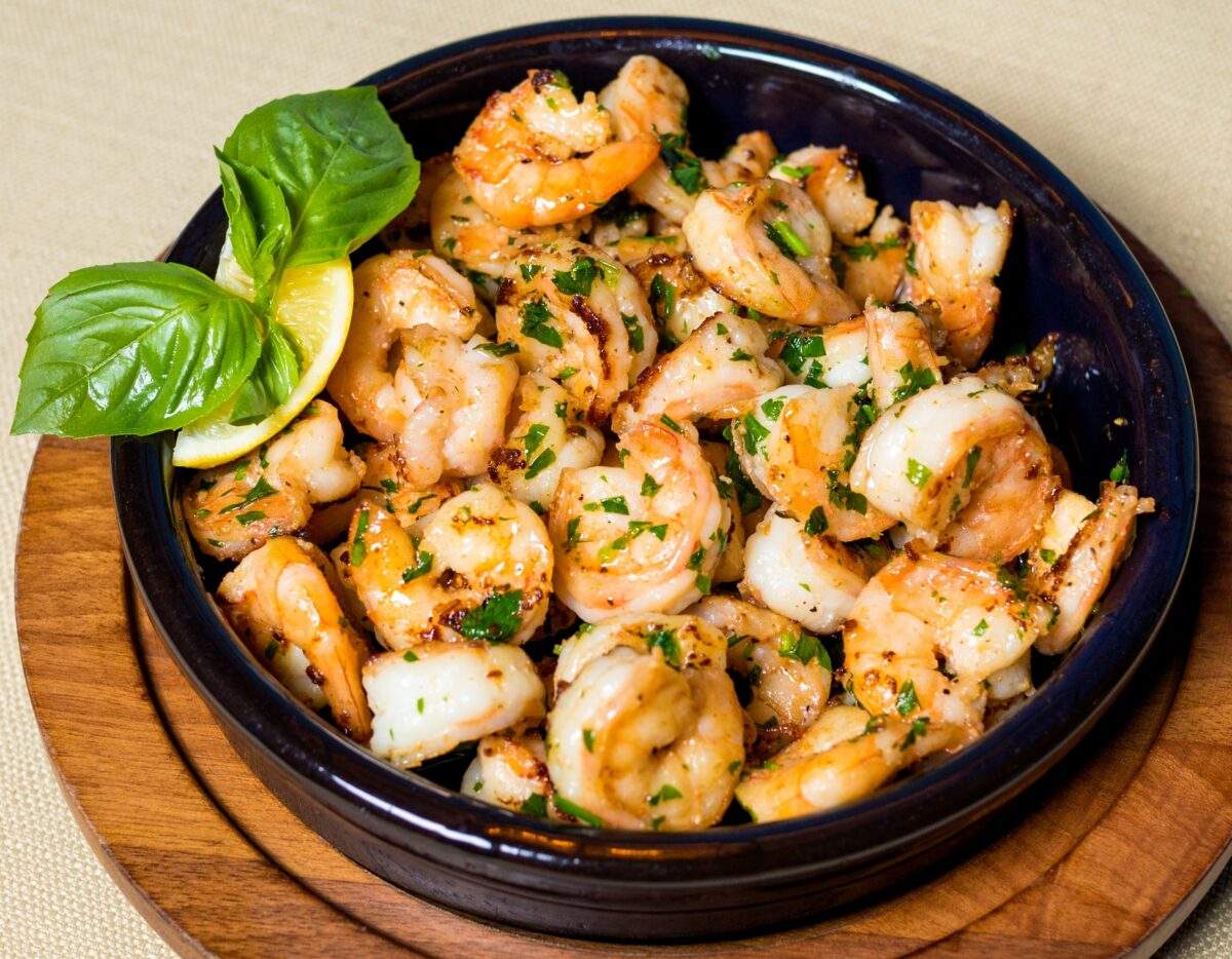 Photograph of grilled shrimp with herbs