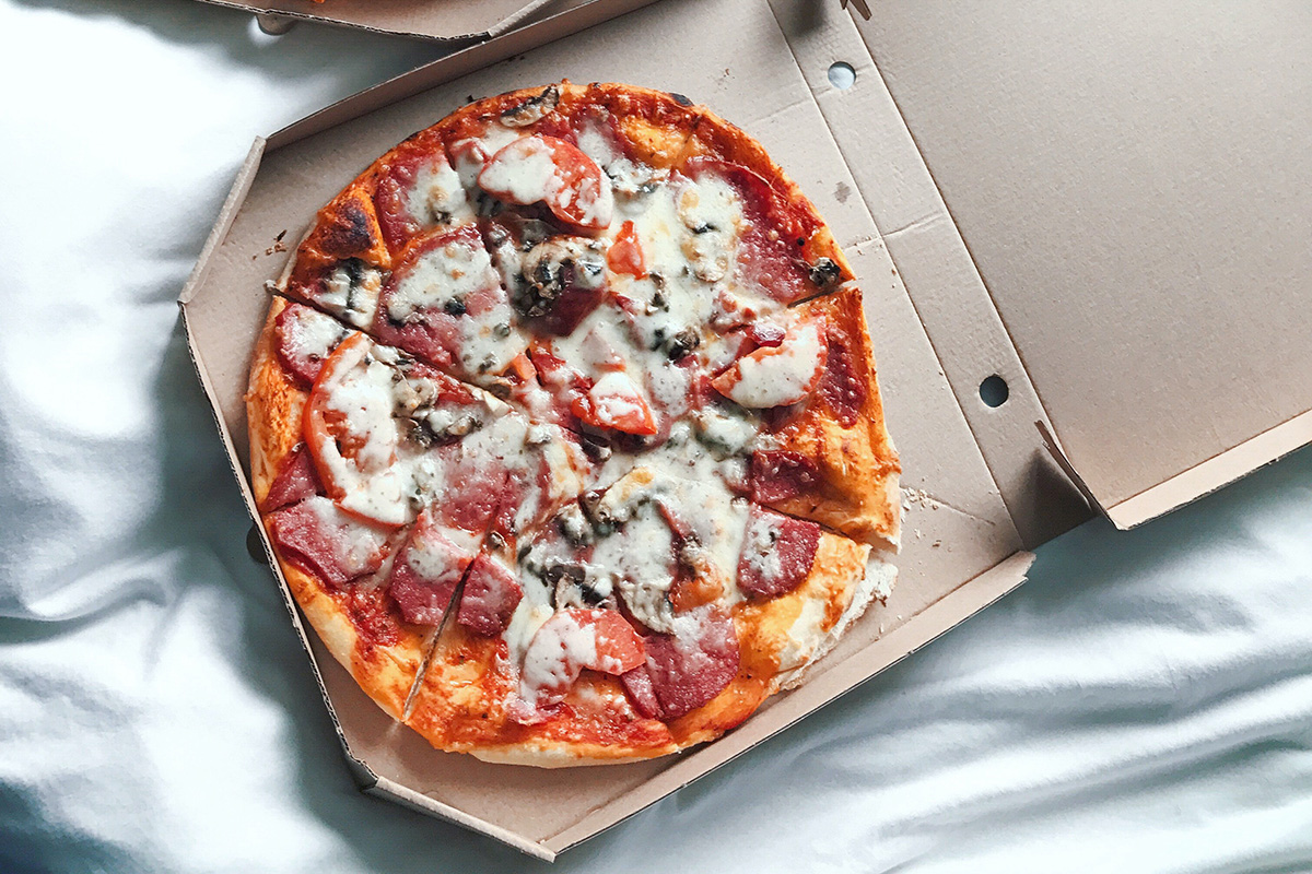 Pizza in a takeout box.