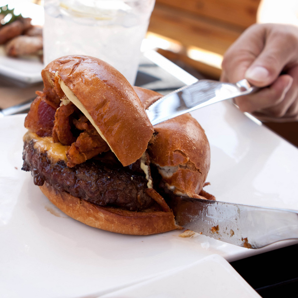 Umami Burger being cut in half in Los Angeles