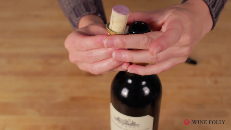 Put the cork in the loop of the foil - wine cork trick